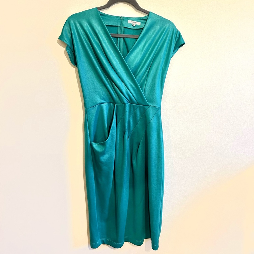 Knee length shiny blue-green body hugging dress with belt